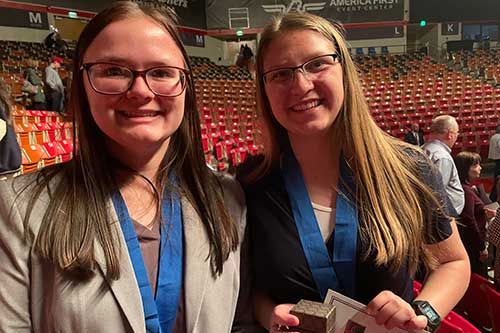 two students receiving scholarship awards