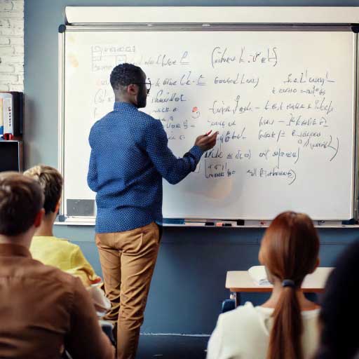 back of a teacher to class, drawing on a whiteboard